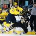 Michigan sophomore left wingman Alex Guptill checks Western Michigan senior Dane Walters on Saturday. Daniel Brenner I AnnArbor.com